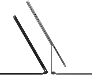 2 iPad Pro devices attached to Magic Keyboard, side exterior, thin profile, space black color with speakers and USB-C port, tilted half open, silver color, open, tilted back showing the keyboard's floating cantilever design, speakers and microphone