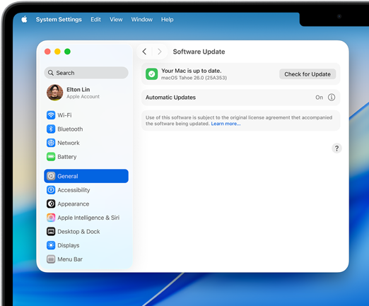 A System Settings window reads "Your Mac is up to date" with macOS Tahoe 26.0 on a 14-inch MacBook Pro