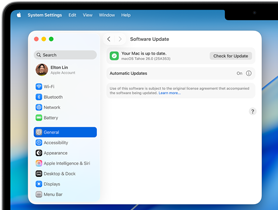 A System Settings window reads "Your Mac is up to date" with macOS Tahoe 26.0 on a 14-inch MacBook Pro