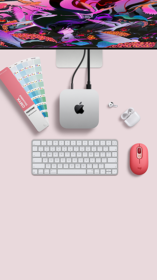 Mac mini, top, silver aluminum, rounded corners, glossy black Apple logo centered, connected by cord, Studio Display partially visible on top, AirPods 4, open, Pantone color swatches, Magic Keyboard, and mouse
