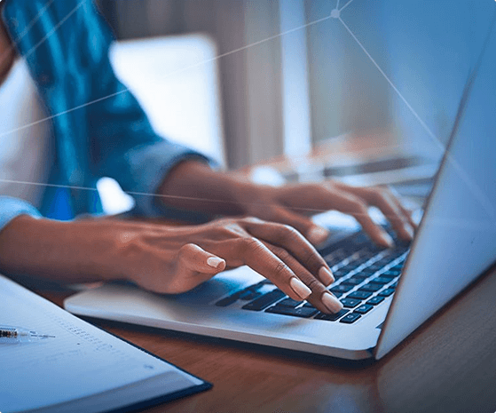 Azure Virtual Desktop - person's hands typing on a laptop