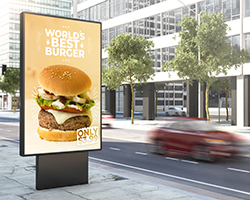 Restaurant digital signage along a downtown city street.